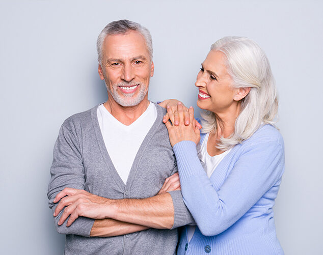 Old happy couple smiling